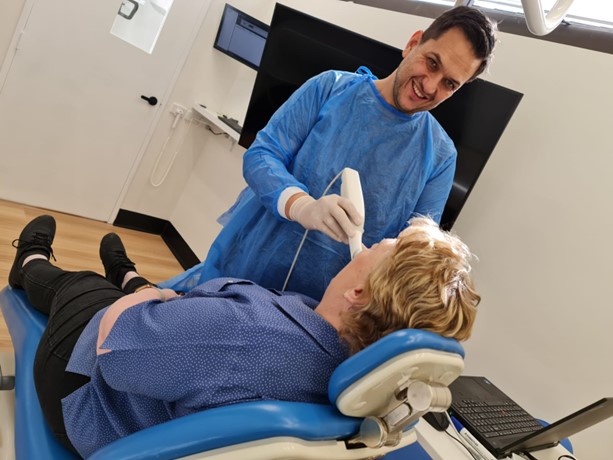 Doctor scanning patients mouth