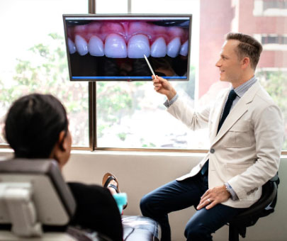 Dr. Marashi discussing cosmetic treatment with his patient